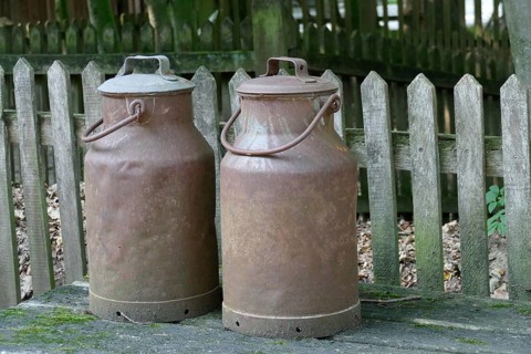 Rusty old iron milk cans