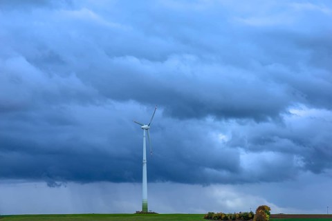 Windmill with rain clouds