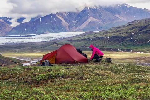 Woman next to tent