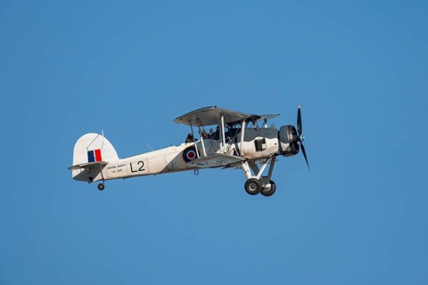 Fairey Swordfish aircraft in flight in Royal Navy markings