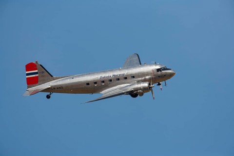 Douglas DC-3 Dakota aircraft in flight in Norway markings