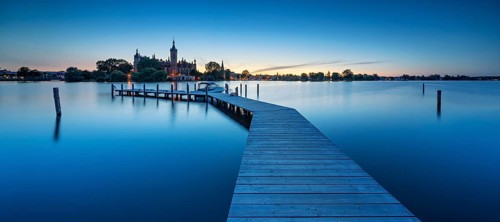 Wooden footbridge at Schwerin Lake at dusk