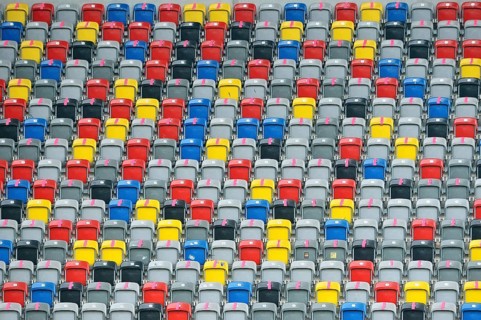 Colourful seating shells in the empty Merkur-Spiel-Arena