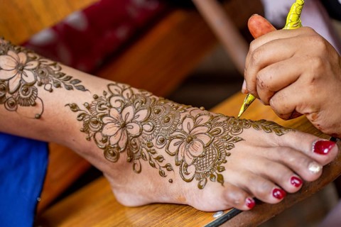 Henna tattoo on foot on a Hindu wedding eve in the island of Mauritius