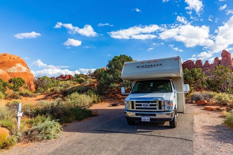 Motorhome in front of rock scenery