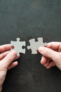 Two puzzle pieces in your hands