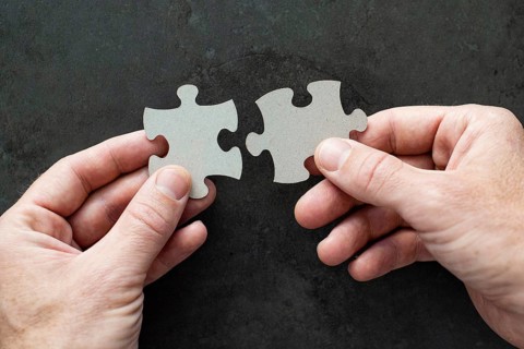 Two puzzle pieces in your hands