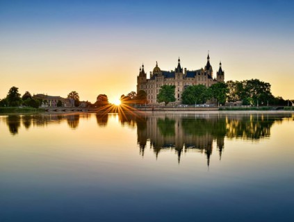 The Schwerin Castle at the Schwerin Lake at sunrise