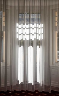 Light falls through curtain