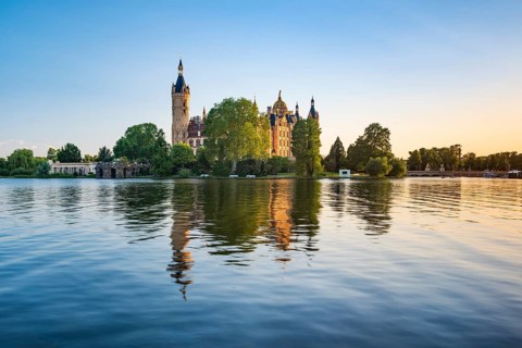 Schwerin Castle reflected in Schwerin Lake in the evening light