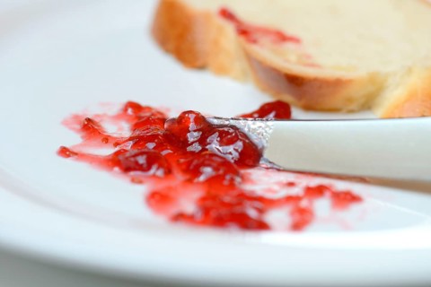 Jam and slice of braided butter