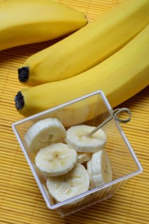 Banana slices in peel and bananas