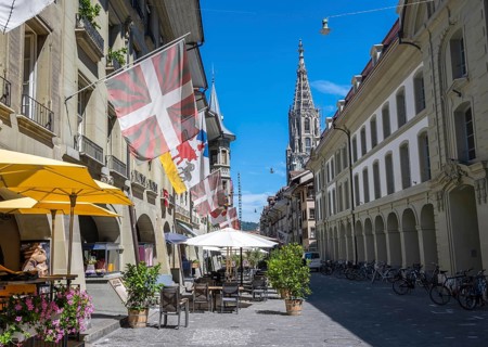 Flags on a row of houses in the old town of Bern