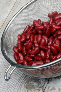 Red kidney beans in sieve