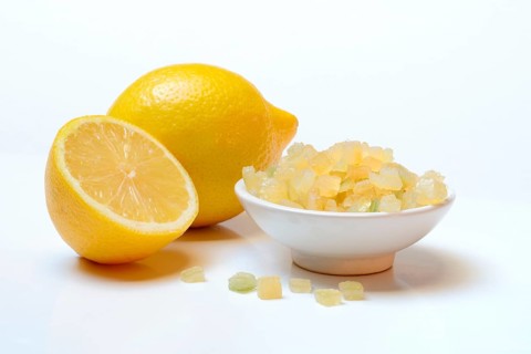 Candied lemon peel cubes and lemon