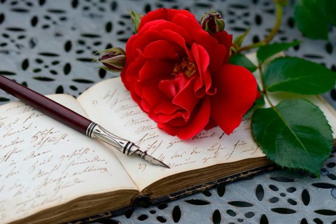 Penholder on book with old writing