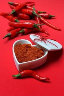 Chili powder in bowl with heart shape