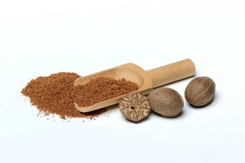 Nutmegs and nutmeg powder in scoop