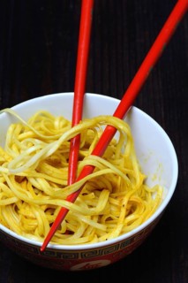 Chinese noodles in bowl with chopsticks