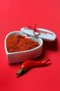 Chili powder in bowl with heart shape