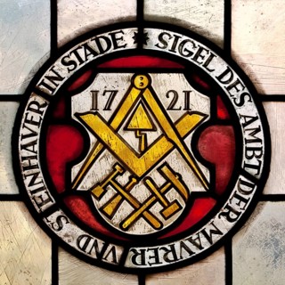 Seal of the guild of masons and stonemasons from 1721 as stained glass window in the town hall