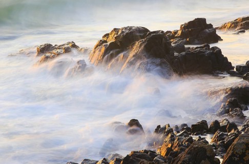 Rocks and waves on the sea coast near Bamburgh