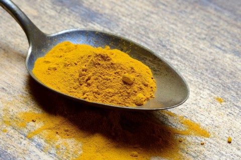 Curcuma powder in spoon