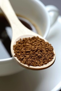 Instant coffee with wooden spoon and coffee cup