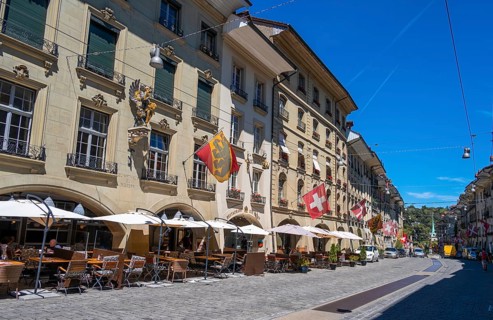 Flags on a row of houses in the old town of Bern