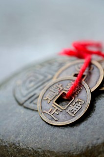 Chinese lucky coins on stone with seal