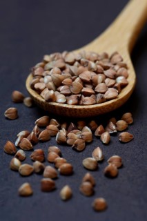 Buckwheat in wooden spoon