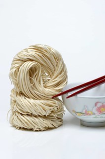Chinese noodles and bowl with chopsticks