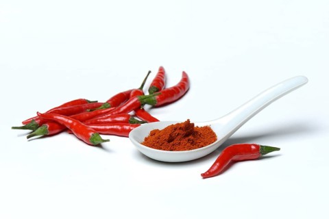 Chili powder in porcelain spoon