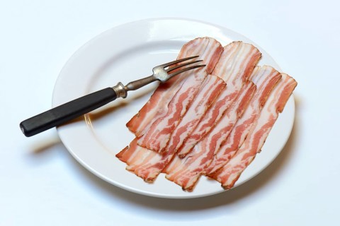 Bacon on plate with fork