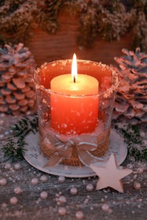 Natural advent decoration with burning candle