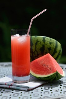 Watermelon juice in glass with drinking straw