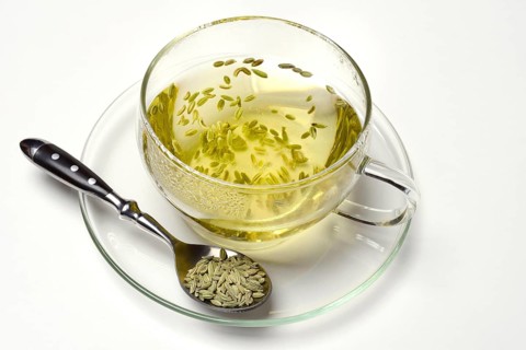 Fennel tea in cup and fennel seeds in spoon