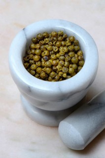 Green pepper in mortar