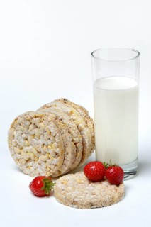 Corn and rice waffles with glass of milk and strawberries