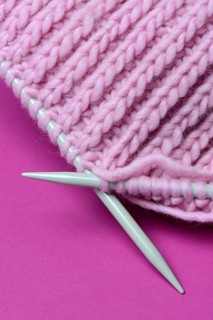 Knitted wool with knitting needles