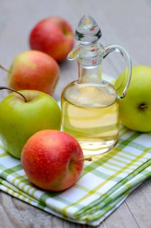 Carafe with apple vinegar and apples