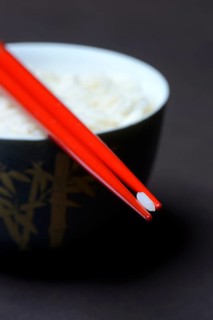 Rice grain on chopsticks