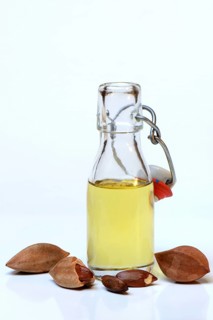 Pilinut oil in bottle and pilinuts