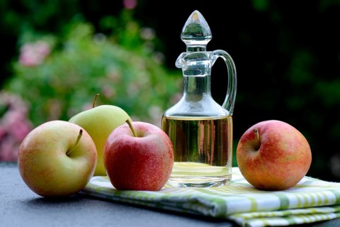Carafe with apple vinegar and apples