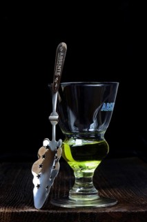 Glass of absinthe with absinthe spoon