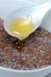 Bowl of swollen flax seed and spoonful of honey