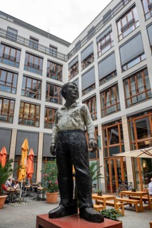 Statue of a man in the courtyard of the Theodor Tucher restaurant near the Brandenburg Gate