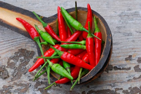 Peppers in wooden shovel