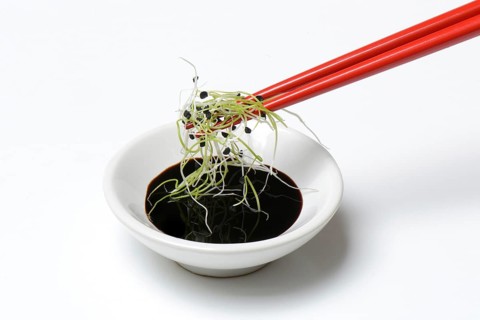 Onion sprouts with chopsticks and peel with soy sauce