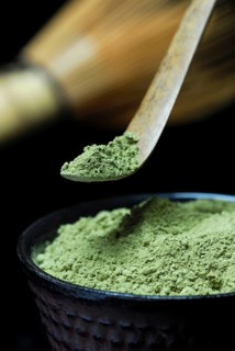 Japanese Matcha tea in bowl with bamboo spoon